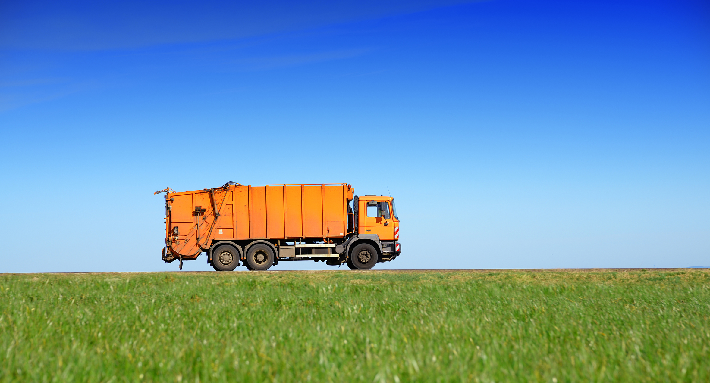 Orange recycling truck