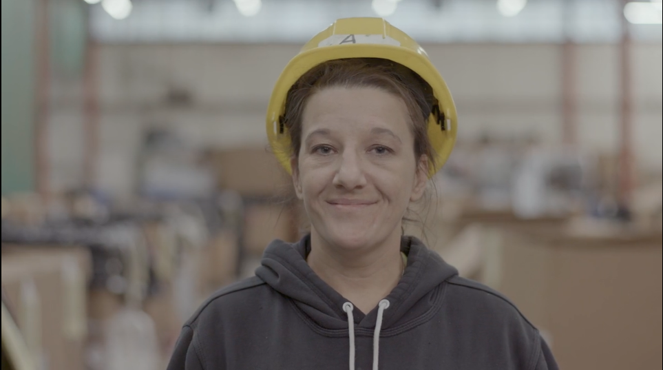 Woman smiling in hard hat