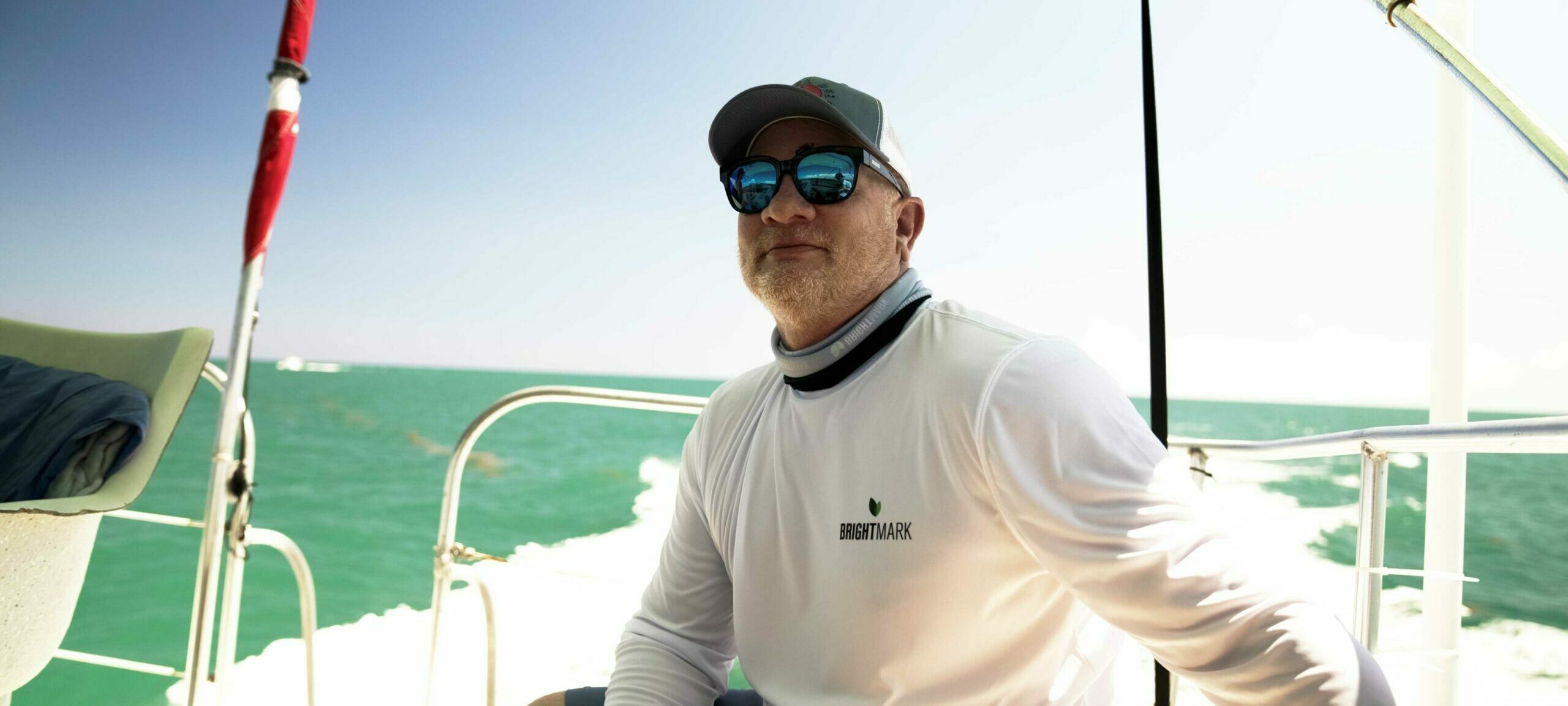 Man smiling on boat in the ocean
