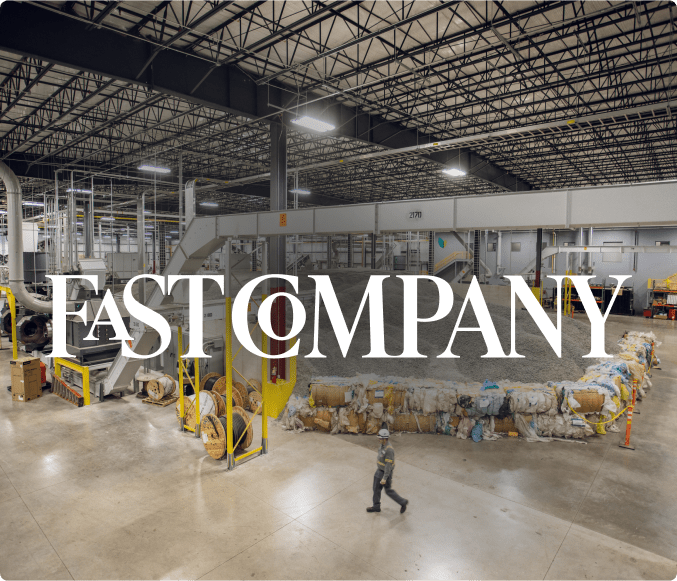 Inside of a plastic renewal facility with the Fast Company logo in the foreground