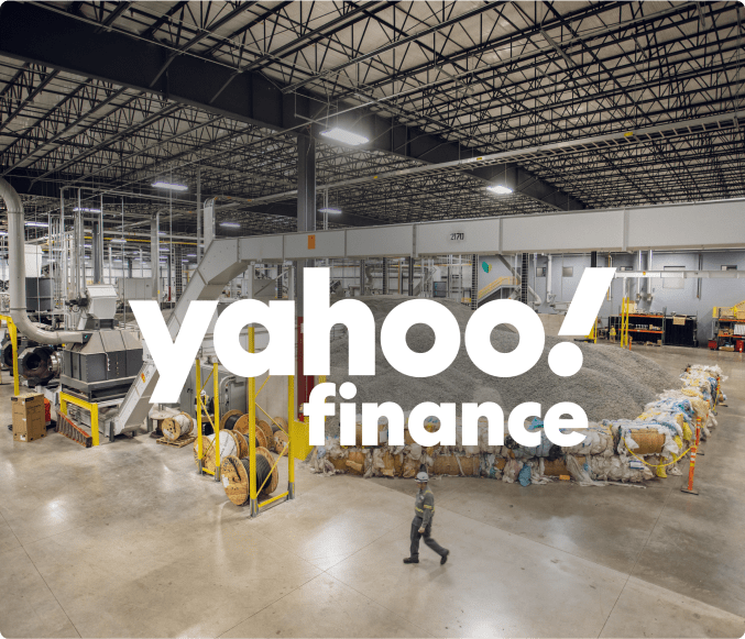 Inside recycling facility with the Yahoo! Finance logo in the foreground