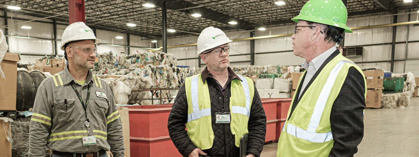 A group of men in a recycling facility